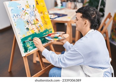 Young non binary man artist smiling confident drawing at art studio - Shutterstock ID 2339306389