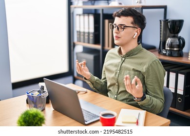 Young non binary man business worker doing yoga exercise at office - Powered by Shutterstock