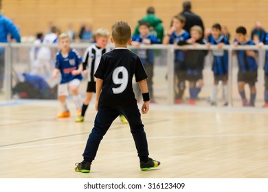 Young Northern European Boys Playing A Indoors Soccer Training Match Inside An Indoor Sports Arena.