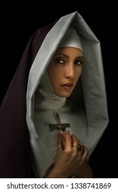 young nun with crucifix