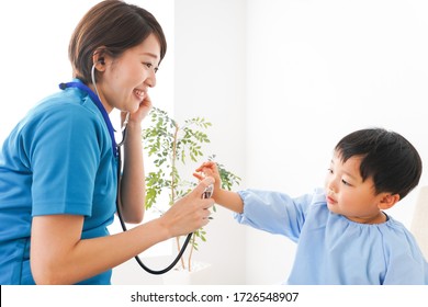 Young Nurse Care For Child