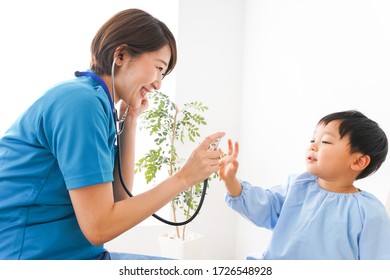 Young Nurse Care For Child