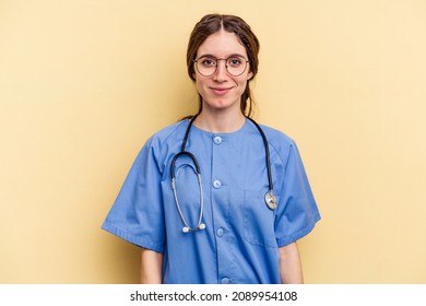 Young Nurse Caucasian Woman Isolated On Yellow Background Happy, Smiling And Cheerful.