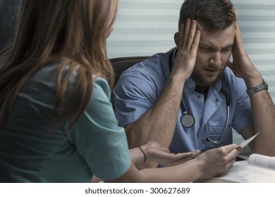 Young Nurse And Doctor Are Arguing