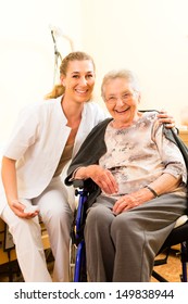 Young nurse and female senior in nursing home, the old lady sitting in a wheel chair - Shutterstock ID 149838944