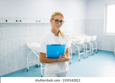 Young Nurse Standing In Maternity Ward.