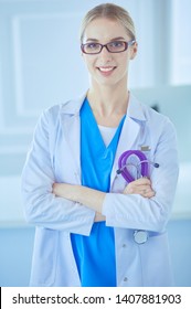 Young Nurse With Stethoscope. Nurse In Green Scrubs With Stetoscope. Medical Student In Uniform