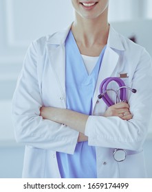 Young Nurse With Stethoscope. Nurse In Green Scrubs With Stetoscope. Medical Student In Uniform