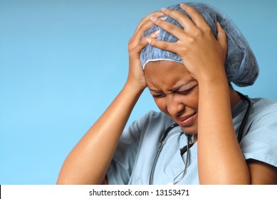 Young Nurse Stressed Out And Upset At Work