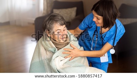 Similar – Caregiver auscultating senior woman