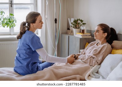 Young nurse taking care of teenage girl. - Powered by Shutterstock