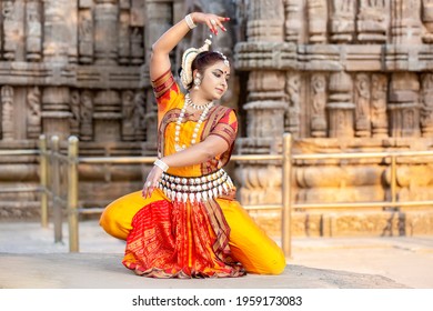 Young odissi female artist shows her inner beauty at Konark Temple, Konark, Odisha, India. Indian culture