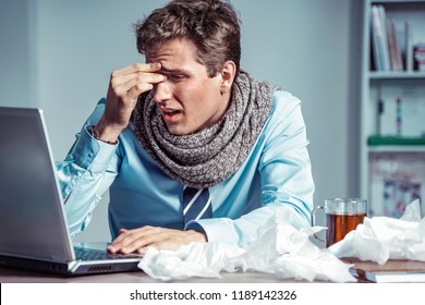 Young office man with pain in his head or an eye. Photo of sick man suffering from stress or a headache grimacing in pain. Business concept - Shutterstock ID 1189142326