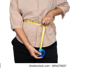 Young Office Woman Using Carpenter Measuring Tape Measuring Her Waist. Using Measuring Tape Tool In The Wrong Way To Measuring Waist.