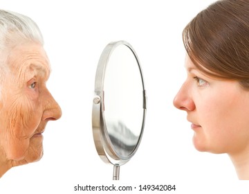 young and old  isolated faces standing on the two sides of the  mirror
