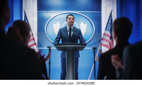 Young Organization Representative Delivers a Successful Speech to Supporters at a Government Election Rally. Crowd is Cheering and Clapping Hands. Minister Speaking at Summit. - Powered by Shutterstock