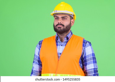 Young Overweight Bearded Indian Man Construction Worker Thinking