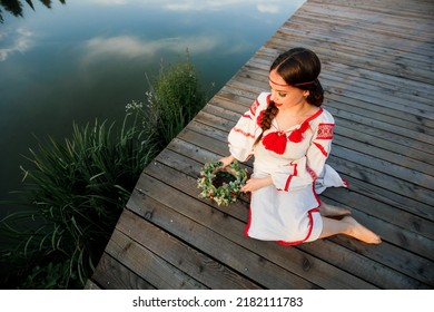 Young Pagan Slavic Girl Conduct Ceremony On Midsummer. Beauti Girl Dressed In A White Blouse With Embroidery