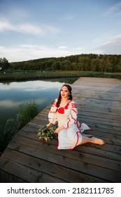 Young Pagan Slavic Girl Conduct Ceremony On Midsummer. Beauti Girl Dressed In A White Blouse With Embroidery