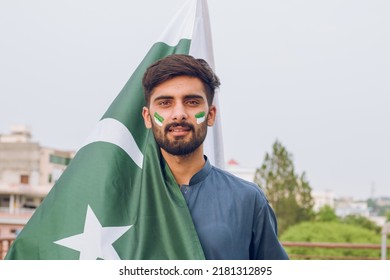 Young Pakistani Or Asian Man Holding Pakistan Flag, 14th August, Independence Day Pakistan 