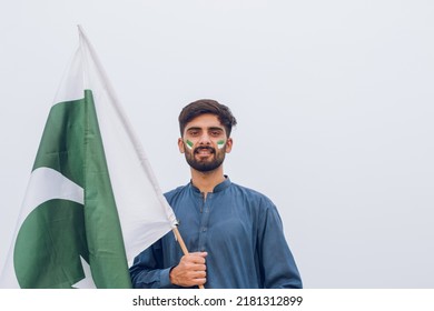 Young Pakistani Or Asian Man Holding Pakistan Flag, 14th August, Independence Day Pakistan