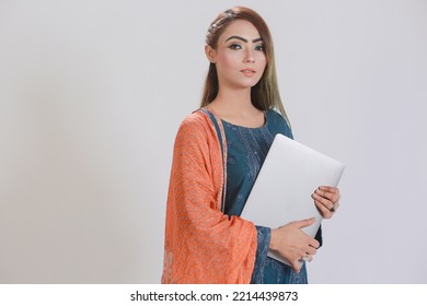 Young Pakistani girl holding a notebook, image can portray a student or a desi female office worker - Shutterstock ID 2214439873