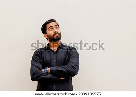 young Pakistani man thinking about things