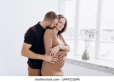 Young Parents Expecting A Baby. Healthy Family.