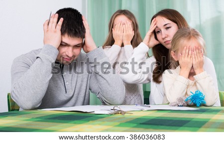Young parents having quarrel adout documents in front of children  Stock photo © 