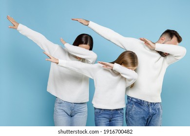 Young Parents Mom Dad With Child Kid Daughter Teen Girl In Sweaters Doing Dab Hip Hop Dance Hands Gesture Youth Sign Hiding Covering Face Isolated On Blue Background. Family Day Parenthood Concept