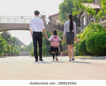 Young Parents Send Their Children To School High Quality Photo