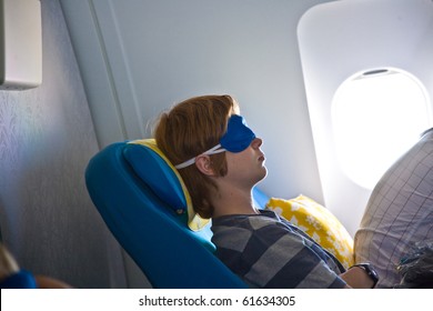 Young Passenger Sleeping In The Business Class