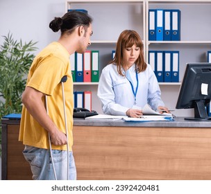 Young patient at the reception in the hospital - Powered by Shutterstock