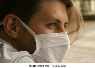 The Young Patient Is Sitting In Front Of The Hospital With His Mask On During Covid 19 Pandemic