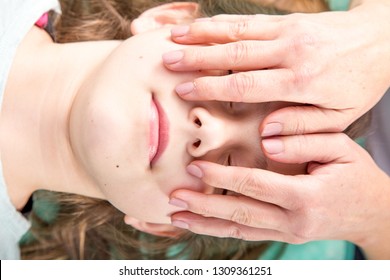 Young patient  undergoing craniosacral biodynamic therapy. Osteopathy manipulation.