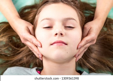 Young patient  undergoing craniosacral biodynamic therapy. Osteopathy manipulation.