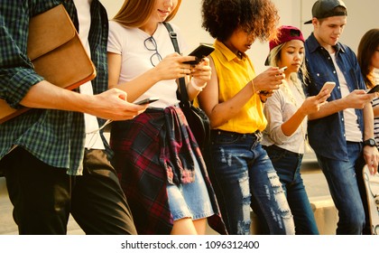 Young people attached to their smartphones - Shutterstock ID 1096312400