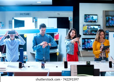 Young People Buying Latest Electronics. Shopping.