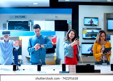 Young People Buying Latest Electronics. Shopping.