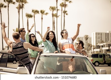 Young People In A Car Having Fun On A Road Trip