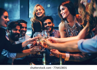 Young people celebrating with champagne - Powered by Shutterstock