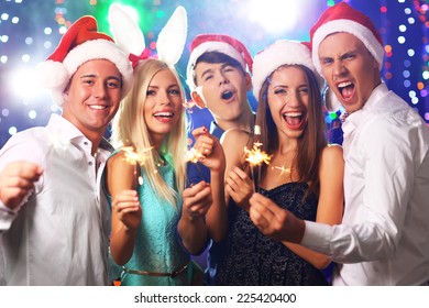 Young People Celebrating Christmas In Club