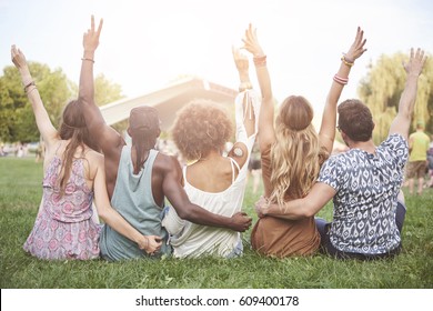 Young People Cheering And Chilling Outside 