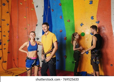 Young people in climbing gym - Powered by Shutterstock