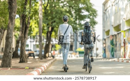 Young people commuting to work using eco-friendly transportation including electric scooters and folding bicycles, encouraging environmentally conscious and sustainable transportation.