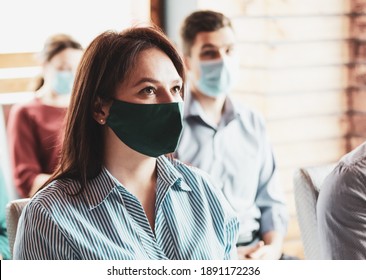 Young People At The Conference With A Mask On Their Faces - The Audience In The Hall Put On Masks On Their Faces - Meeting In The Audience In The Conditions Of The New Narmal