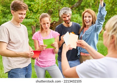 Young People In A Creative Team Building Workshop With Colorful Cards To Get To Know Each Other