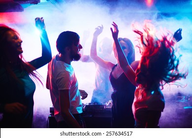 Young People Dancing In Nightclub