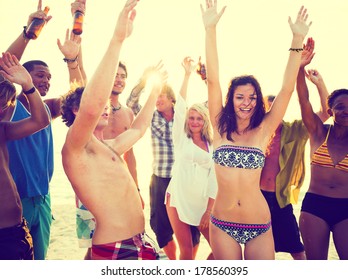 Young People Dancing At Summer Beach Party