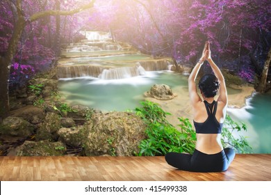 Young People Do Yoga Outdoors At Water Fall ,In Order To Have Good Health